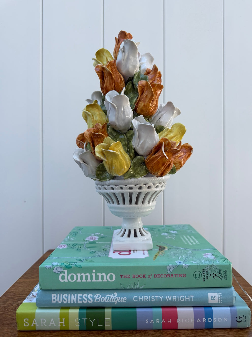 Ceramic tulip topiary in white pedestal urn, view 1