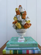 Ceramic tulip topiary in white pedestal urn, view 1