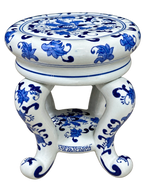 Blue and white floral ceramic stand with scroll feet, angled view