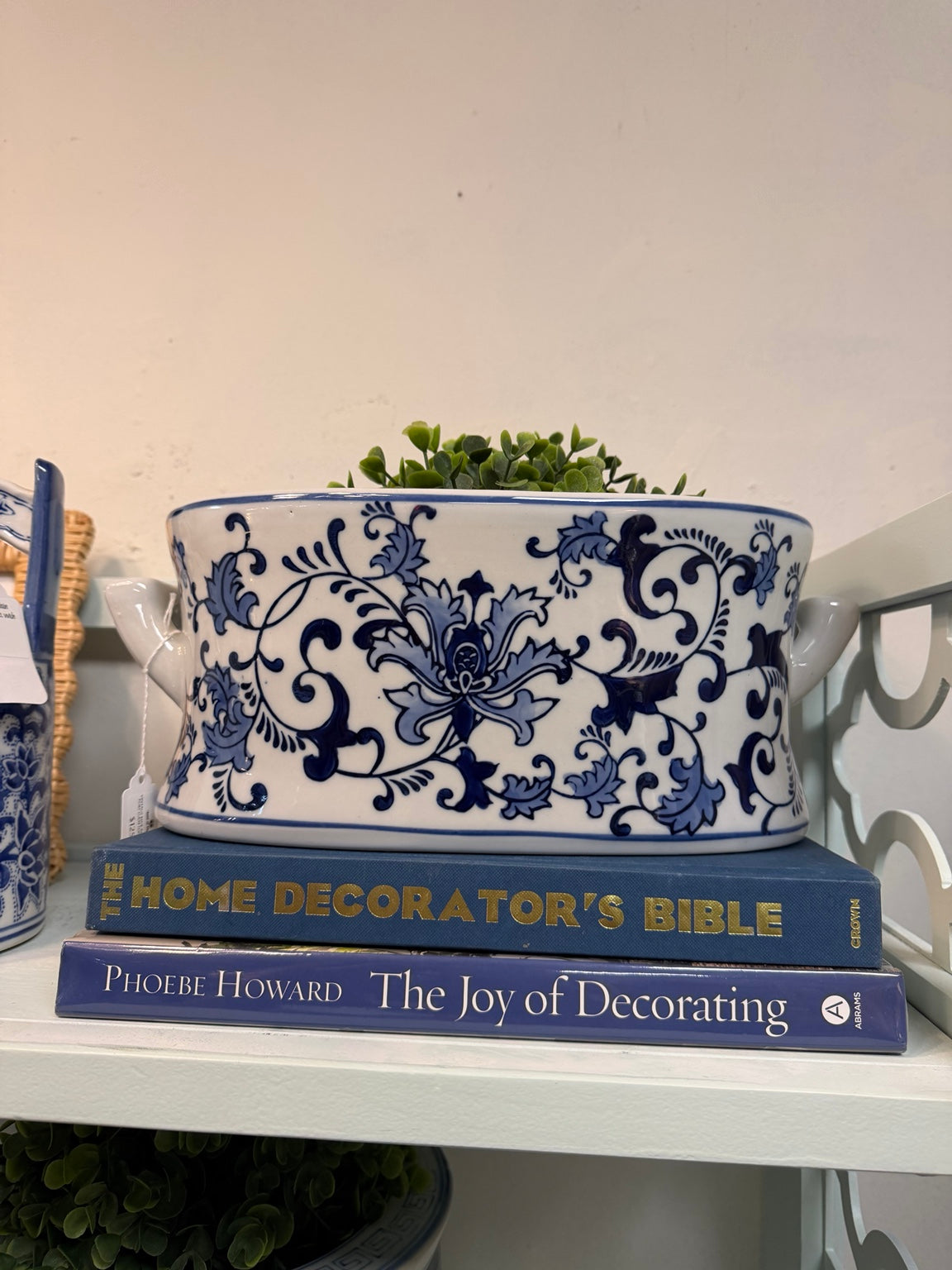 Blue-and-white oval handled planter with floral scrollwork