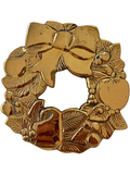 Brass Christmas wreath trivet with bow and foliage