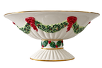 Christmas pedestal bowl with holly garland, red bows and gold trim, front view