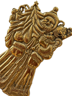 Detail of Father Christmas brass trivet with tree and toys