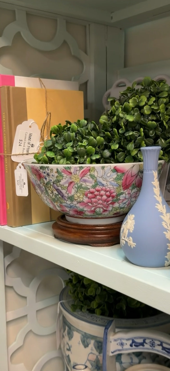 Floral chinoiserie decorative bowl with pink blossoms, green foliage, and blue and yellow accents on white, styled in the House of Péarla booth.