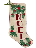 Front of NOEL needlepoint Christmas stocking with holly and green bow