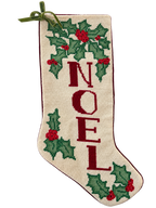 Front of NOEL needlepoint Christmas stocking with holly and green bow