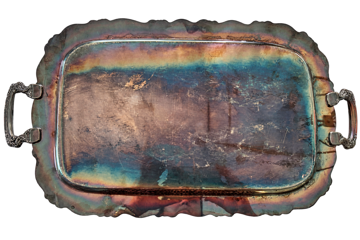 Vintage handled tray underside showing tarnish and scratches