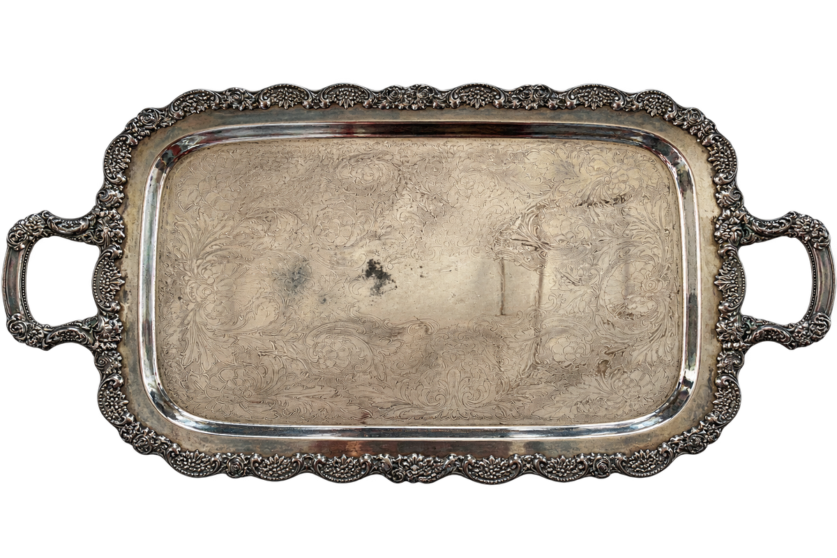 Vintage ornate handled tray front showing wear