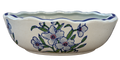 Oval porcelain bowl with blue scalloped rim, green leaves and floral decoration