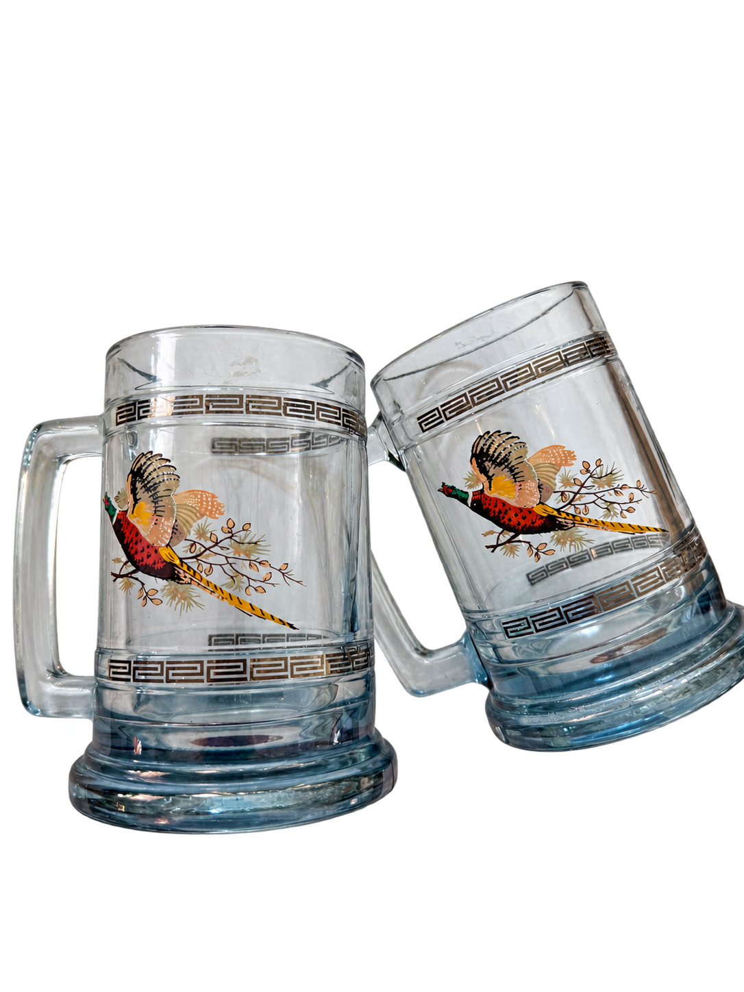Vintage pheasant glass beer mugs with Greek key trim, pair angled view