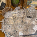 Set of four crystal martini glasses displayed on a silver tray