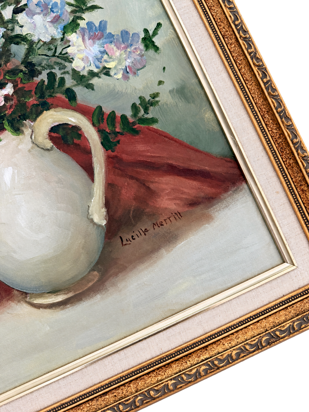 Close-up of floral still life showing the Lucille Merrill signature, canvas texture, cream liner, and ornate gold frame
