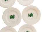 Close-up of green urn design and raised lace borders