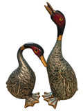 Pair of vintage painted metal duck figurines