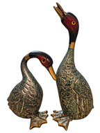 Pair of vintage painted metal duck figurines