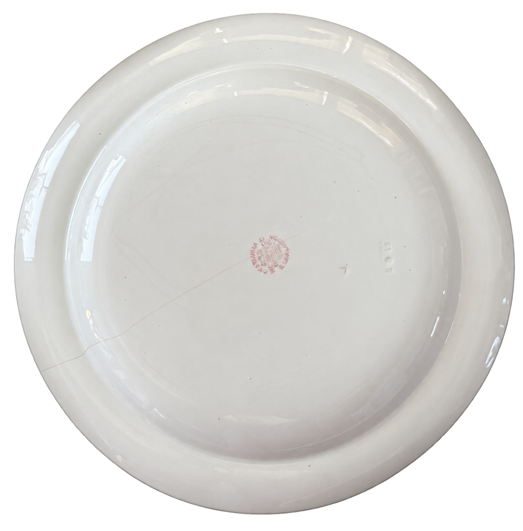 Wedgwood plate underside with background removed; maker marks and condition visible