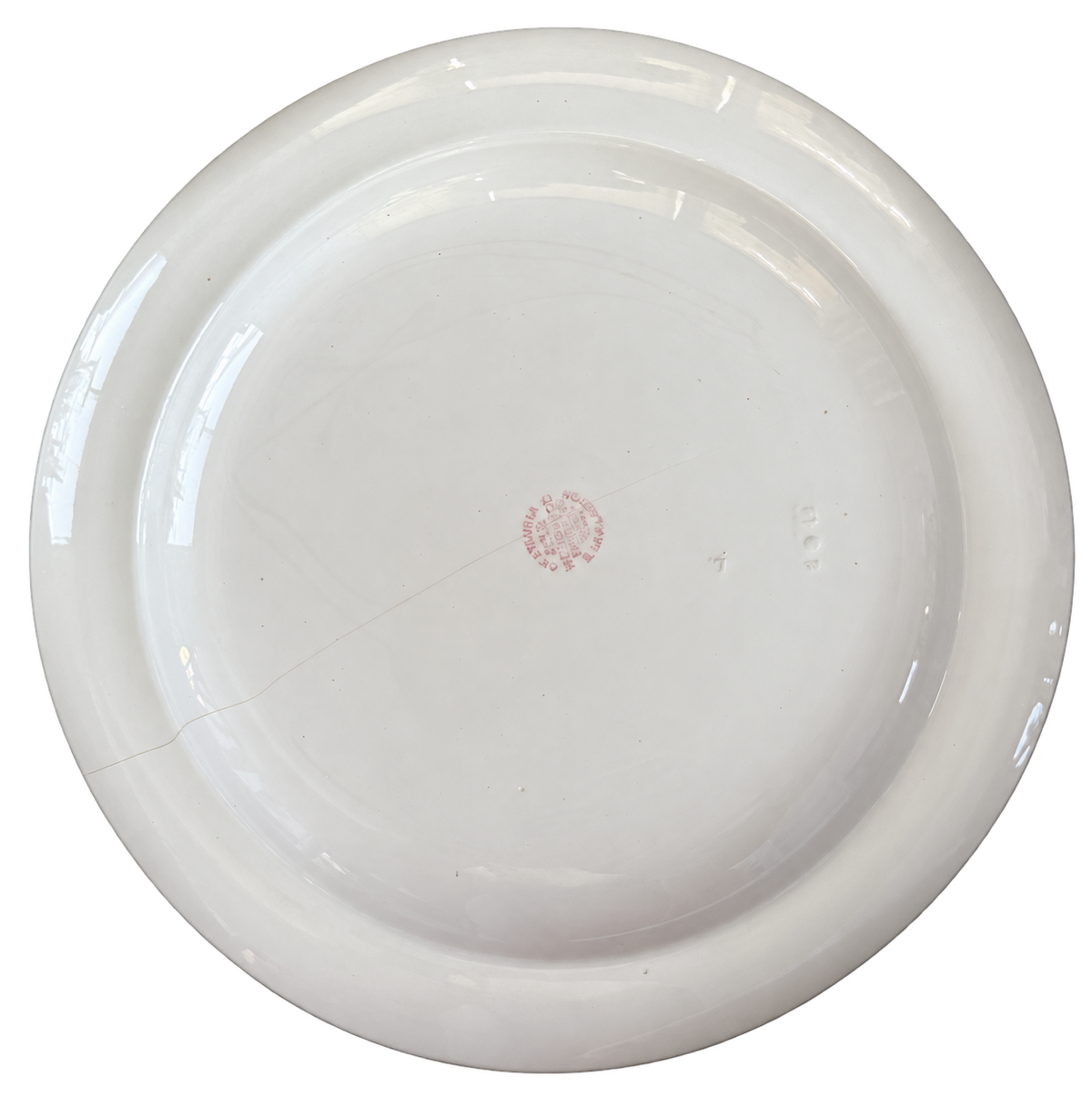 Wedgwood plate underside with background removed; maker marks and condition visible