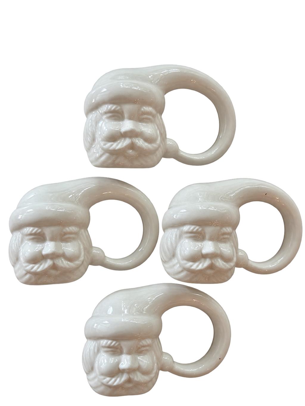 Set of four white ceramic Santa Claus napkin rings