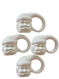 Set of four white ceramic Santa Claus napkin rings