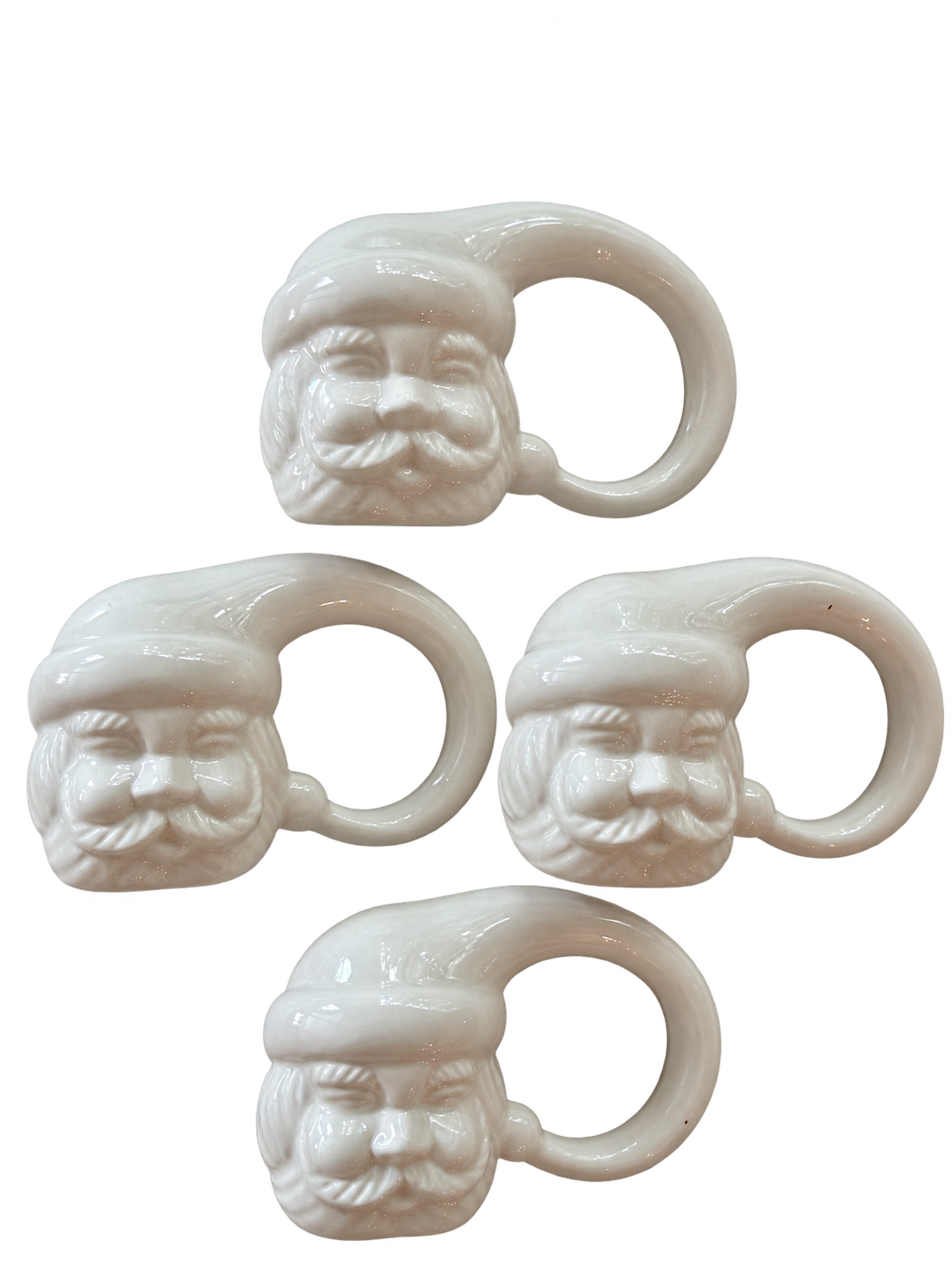 Set of four white ceramic Santa Claus napkin rings